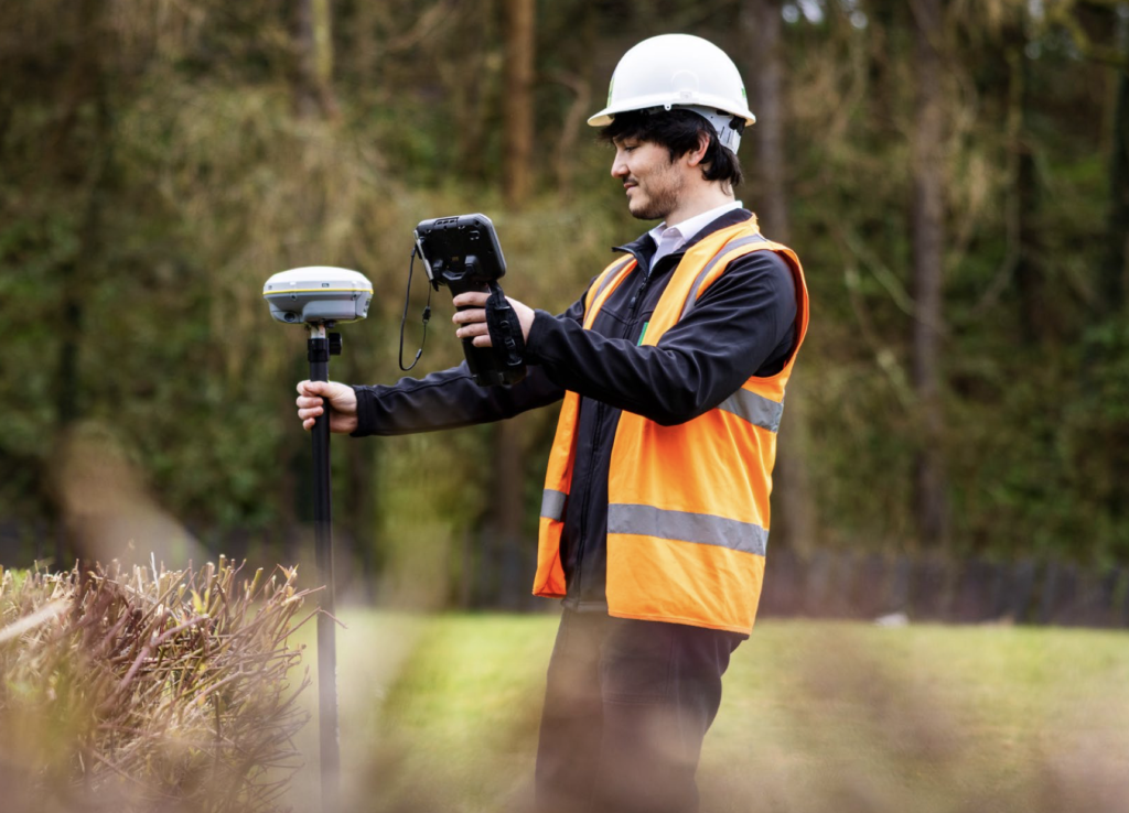 Field engineer taking measurements on site. 