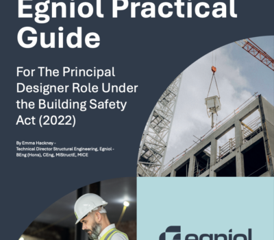 The front cover of the Guide shows a large building under construction and an engineer checking plans